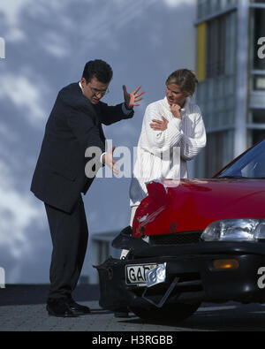 Traffic accident, passenger car, damage to the bodywork, man, furiously, gesture, woman, call accident, car accident, damage, front damage, car, red, other party, outrage, terror, fury, rage Stock Photo
