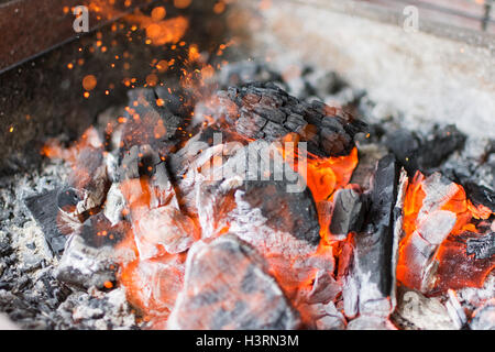 Hot Charcoal Glowing Briquettes. Burning Charcoal Close Up. Stock Photo