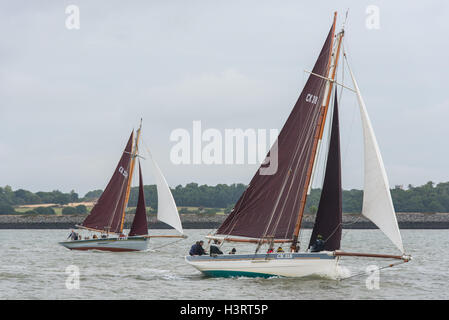 Gaff-rigged smacks CK 258 Charlotte Ellen and CK318 Alberta racing off Brightlingsea in Essex. Stock Photo