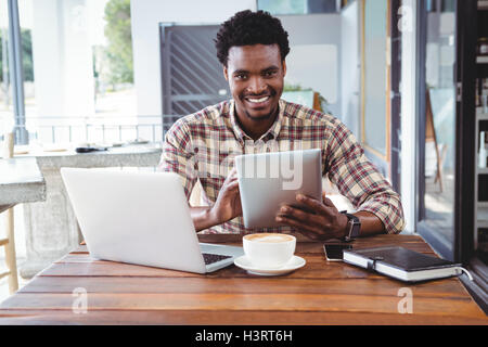 Man using digital tablet Stock Photo