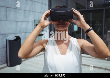 Woman using reality virtual headset Stock Photo