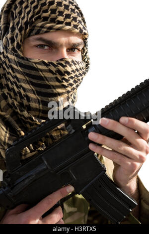 Portrait of soldier holding a rifle Stock Photo