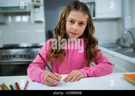 Girl doing her homework Stock Photo