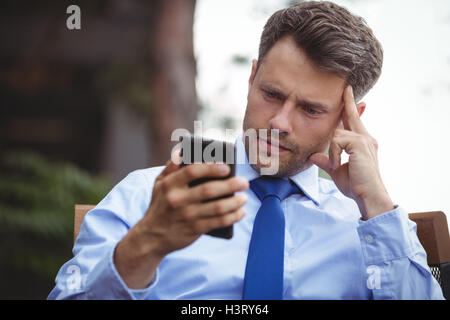 Businessman using mobile phone Stock Photo