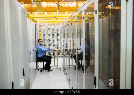 Technician working on laptop Stock Photo