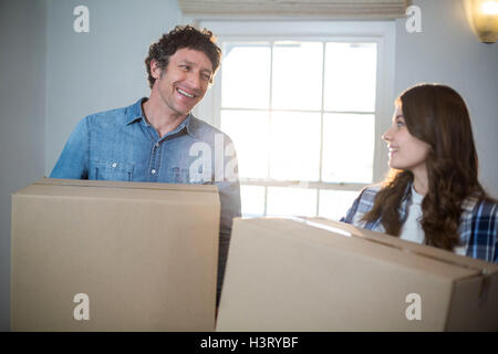 Couple holding cardboard boxes Stock Photo