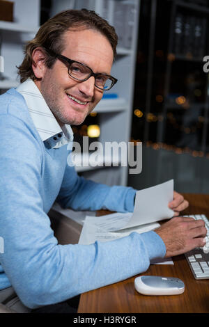 Businessman working on computer in office Stock Photo