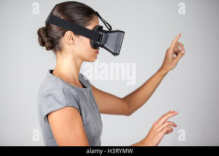 Woman using virtual reality headset Stock Photo