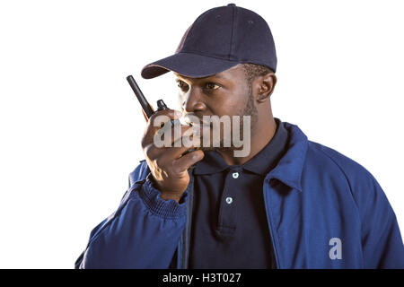 Security officer talking on walkie-talkie Stock Photo