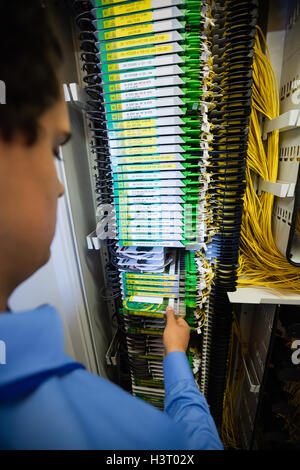 Technician checking routers Stock Photo