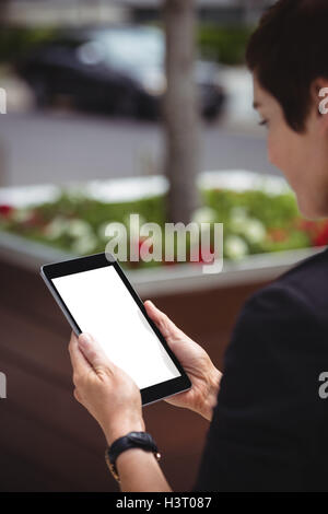 Businesswoman using digital tablet Stock Photo