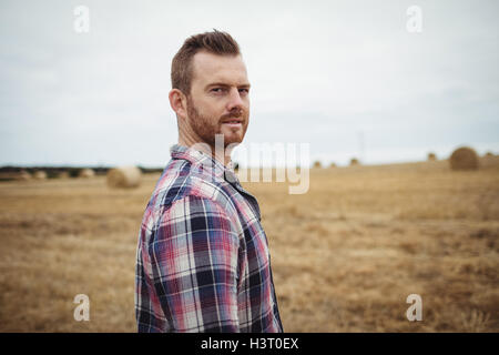 Portrait of farmer standing in the field Stock Photo