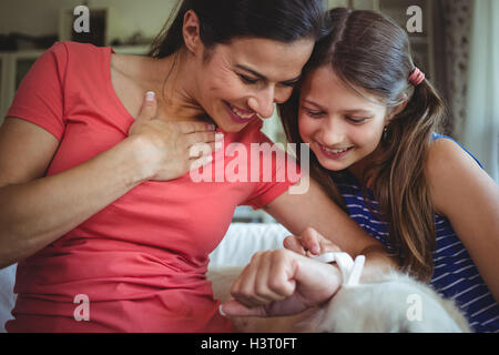 Mother and daughter checking the smart watch Stock Photo