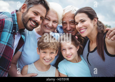 Happy multi-generation family standing  outdoors Stock Photo