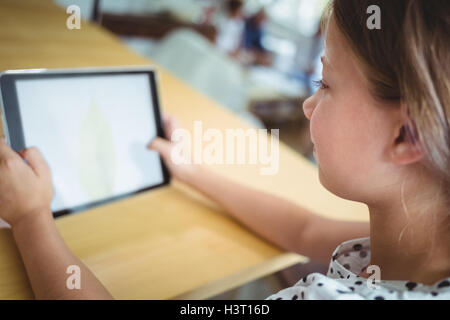 Girl using digital tablet Stock Photo
