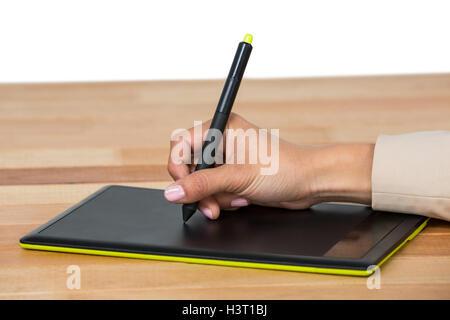 Hand of graphic designer using graphic tablet Stock Photo