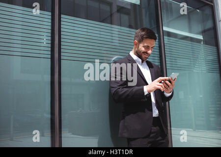 Businessman using mobile phone Stock Photo