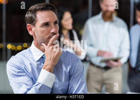 Thoughtful businessman in the office Stock Photo