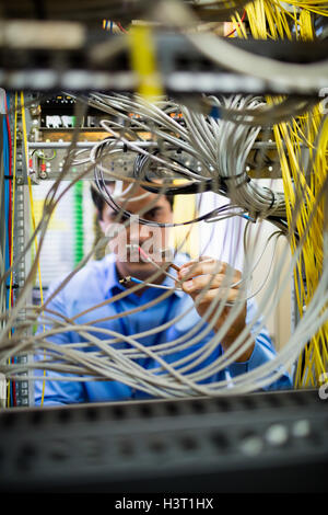 Technician fixing cable Stock Photo