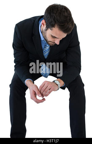 Businessman checking time Stock Photo