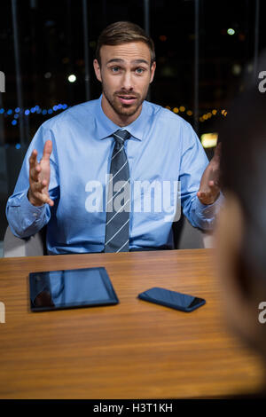 Businessman having a discussion in office Stock Photo