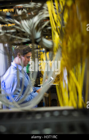Technician using digital tablet Stock Photo