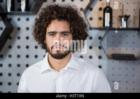 Bartender standing in bar counter Stock Photo
