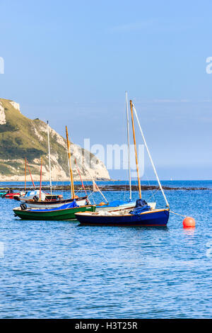 Sailing boats moored in Ringstead Bay, Dorset, England, UK, on a calm and sunny summer afternoon Stock Photo