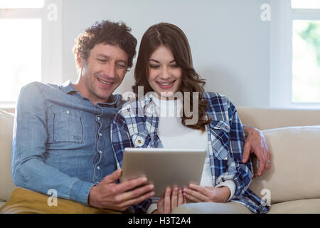 Couple using digital tablet Stock Photo