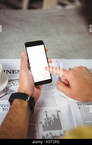 Hands of man holding mobile phone Stock Photo