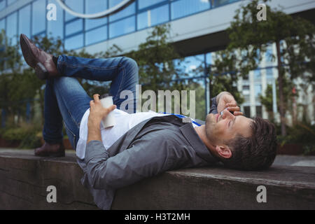 Handsome business executive talking on mobile phone Stock Photo