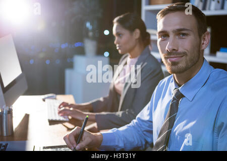 Businesspeople working in office Stock Photo
