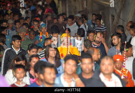 Kathmandu, Nepal. 11th Oct, 2016. Devotees dressed up as deity carrying sword participate in Khadga Jatra(Sword Procession) on Dashami, the tenth day of Dashain festival in Kathmandu, Nepal. Newar community of valley take out a victory parade of sword procession from different places. © Archana Shrestha/Pacific Press/Alamy Live News Stock Photo