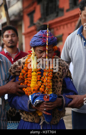 Kathmandu, Nepal. 11th Oct, 2016. A Devotee dressed up as deity carrying sword participate in Khadga Jatra(Sword Procession) on Dashami, the tenth day of Dashain festival in Kathmandu, Nepal. Newar community of valley take out a victory parade of sword procession from different places. © Archana Shrestha/Pacific Press/Alamy Live News Stock Photo