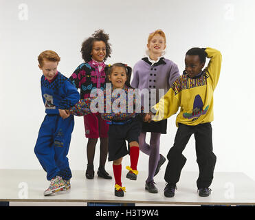 Children, nationality, differently, dance, inside, girls, boys, different colour of skin, dance group, melted, happy, fun, amuses, together, together, funnily, cheerfully, cheerfulness, mood, positively, friends, friendship, studio, cut out Stock Photo