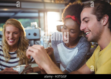 Man and woman using mobile phone Stock Photo