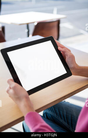 Woman using a digital tablet in the coffee shop Stock Photo