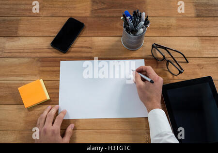 Businessman writing on a document Stock Photo