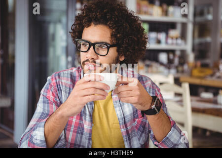 Thoughtful man having coffee Stock Photo