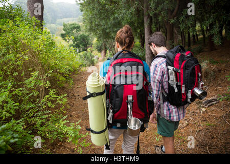 Hiker couple hiking in forest Stock Photo
