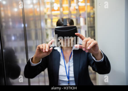 Technician using visual reality headset Stock Photo
