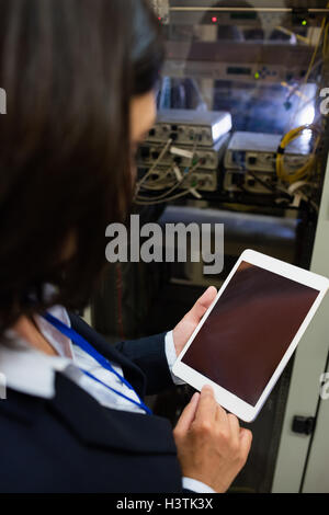 Technician using digital tablet Stock Photo