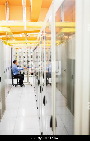 Technician working on laptop Stock Photo