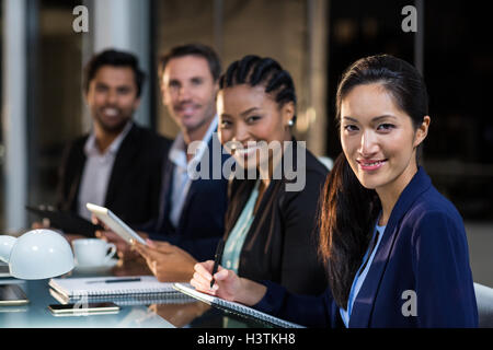 Group of businesspeople sitting in a meeting Stock Photo