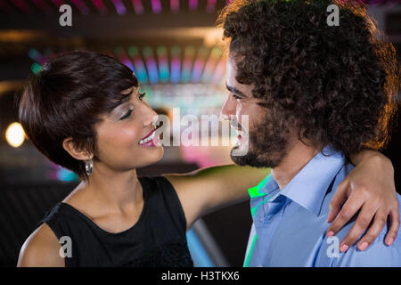Romantic couple dancing together on dance floor Stock Photo