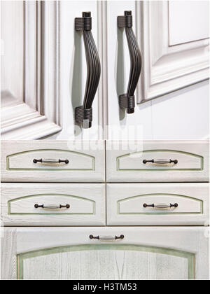 silver handles on cabinet doors Stock Photo