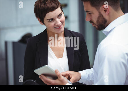 Businesspeople using digital tablet Stock Photo