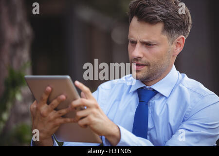 Businessman using digital tablet Stock Photo