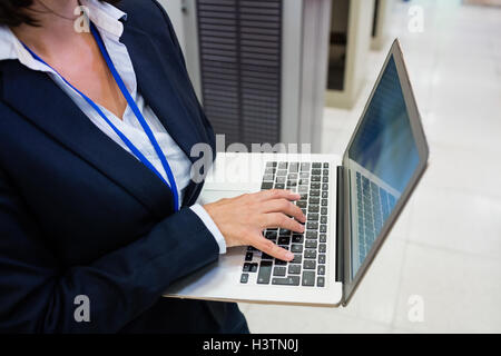 Technician working on laptop Stock Photo