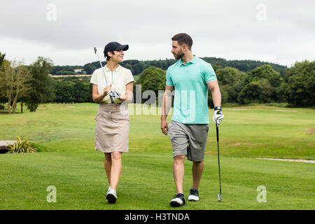 Couple interacting with each other while walking Stock Photo
